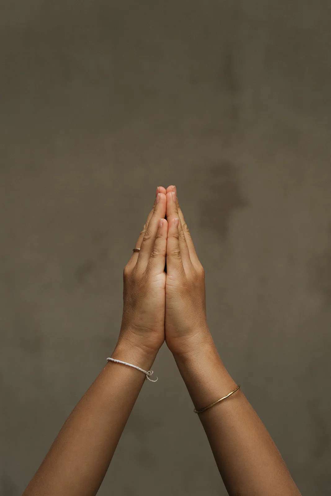 Hands in prayer during yoga practice.